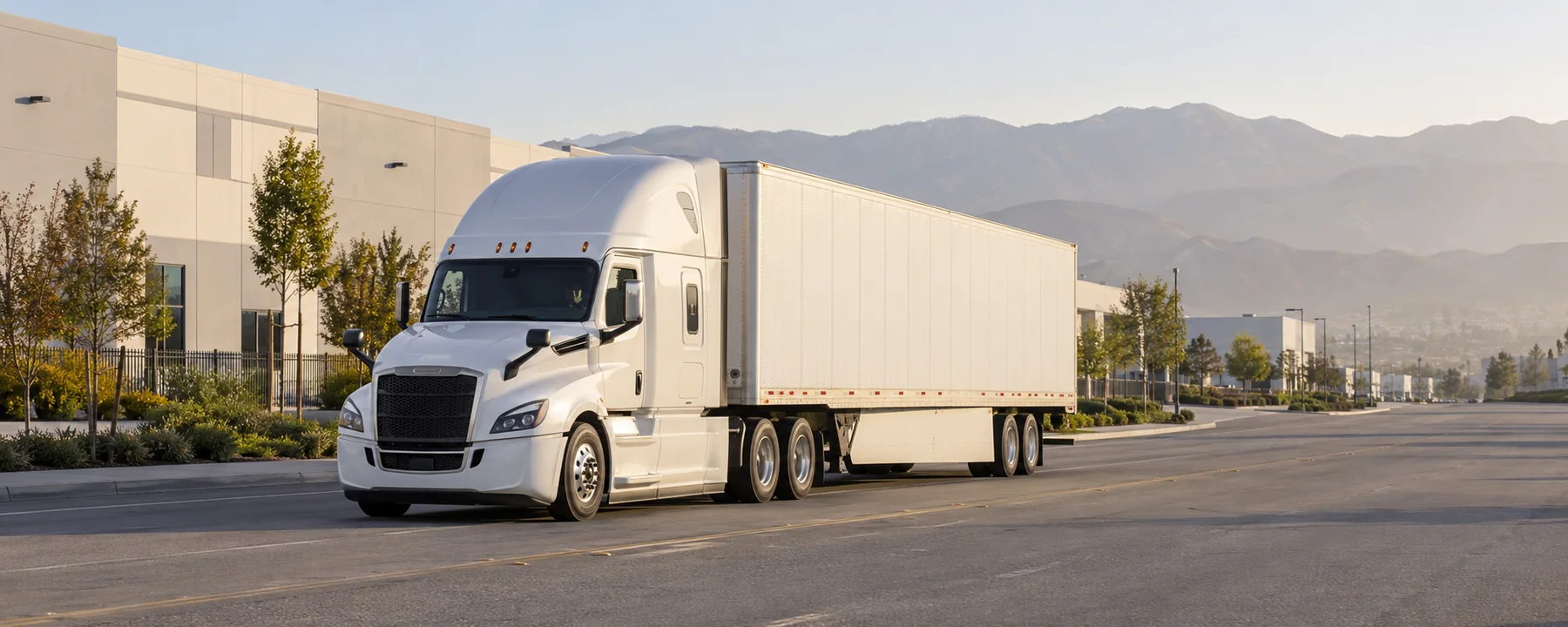 AI-generated American semi-truck and dry van trailer on a Southern California industrial road
